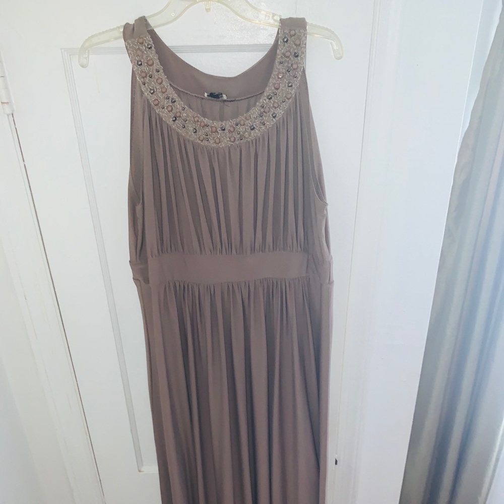 Neutral/Natural gown with empire waist.